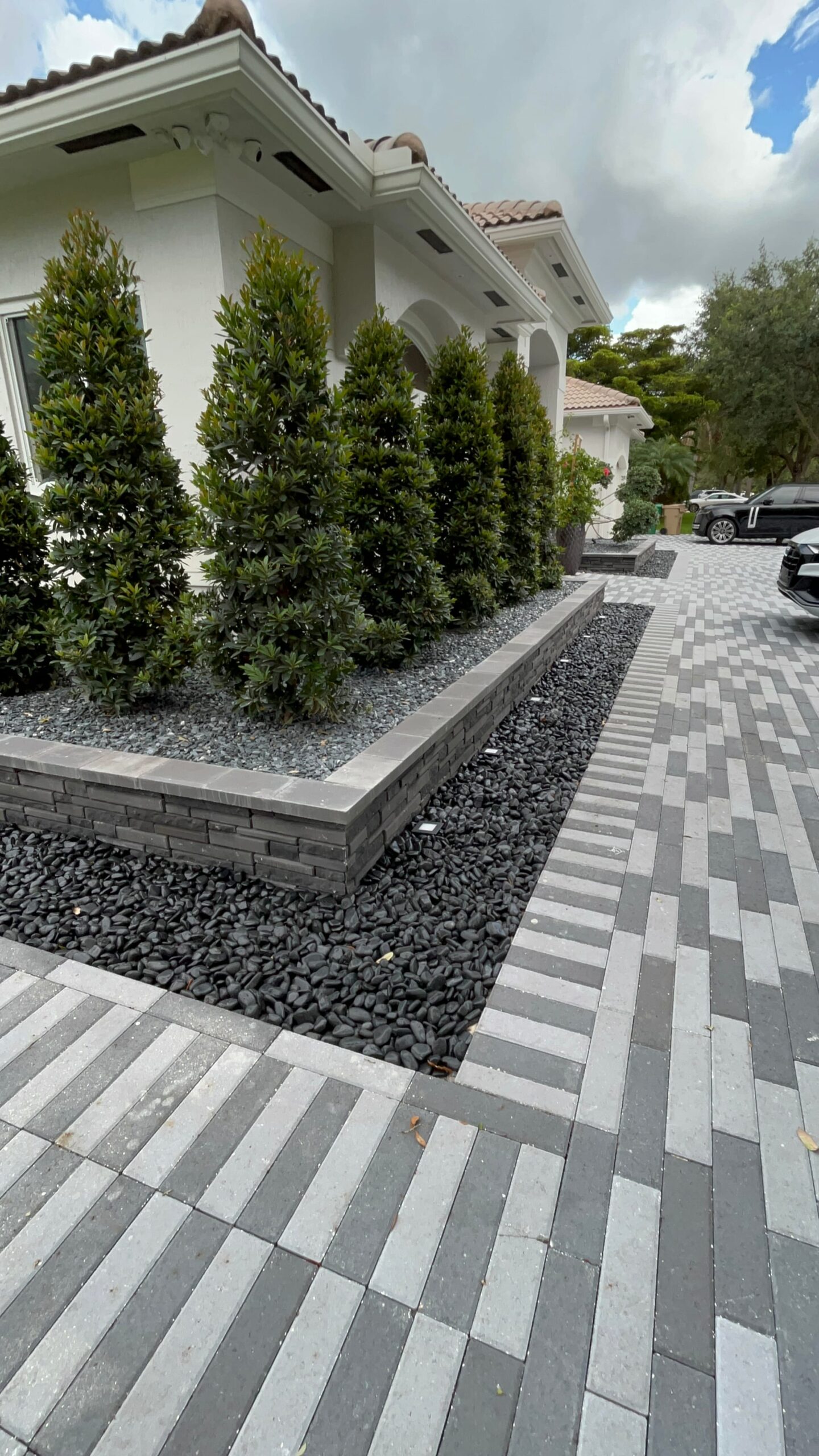 Custom retaining wall installation for residential landscape in Broward County, Florida