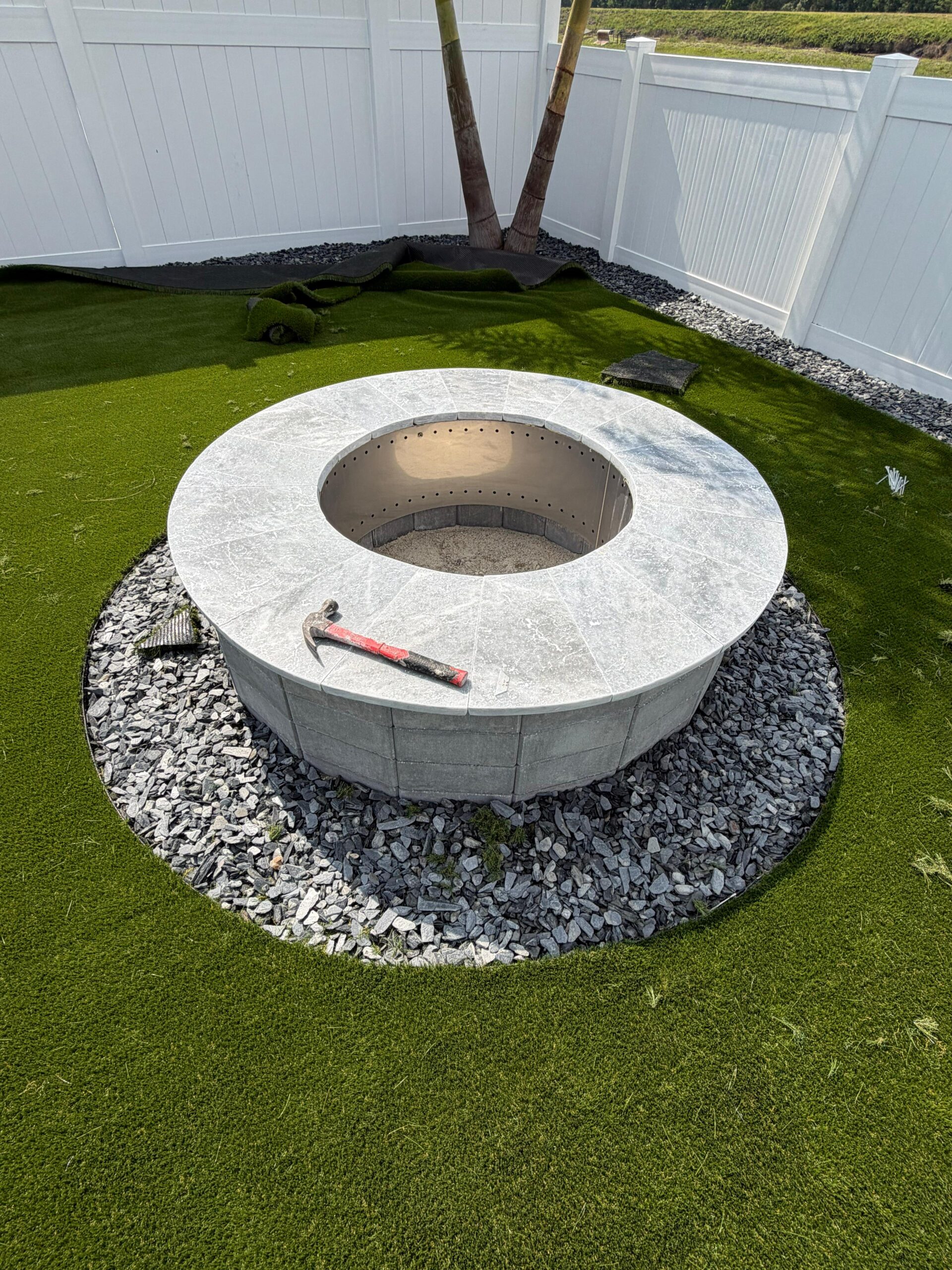 Natural travertine outdoor living space installed in Broward County.